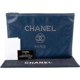 Chanel Grained Calfskin Studded O Clutch Bag